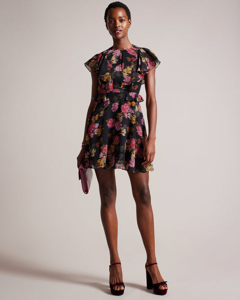 TIIAH-Dresses-Step into effortless elegance with our TIIAH dress. Our glitched floral print offers contemporary style, while the peplum waist enhances the silhouette. It is the ideal option for anyone looking for both style and sophistication. Mini dress Glitched floral print Angel sleeves A-line silhouette Peplum frilled waist Zip fastening Silvia is 5'11" / 1.8m and wears Black in a Ted size 1- Ted Baker Romania
